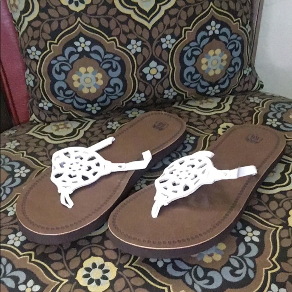 White medallion sandals